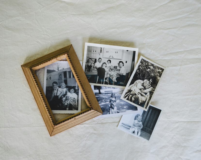 Overhead view of old black-and-white Jose Mier family photographs